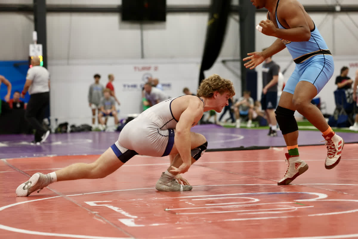 Sam Harper wrestling stance at UCD 2025