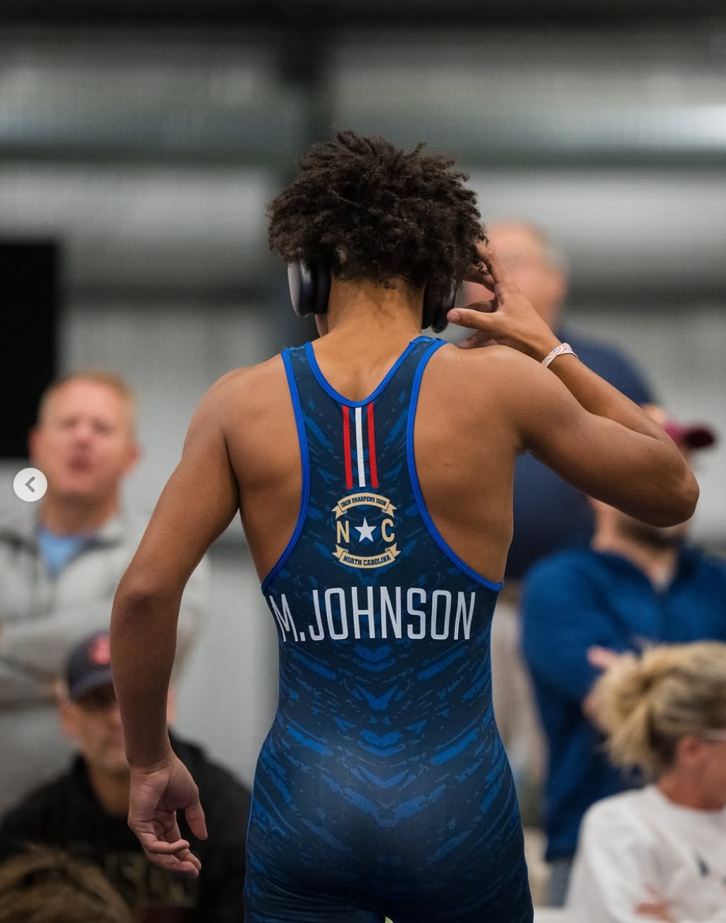 Mac Johnson in wrestling action at UCD 2024