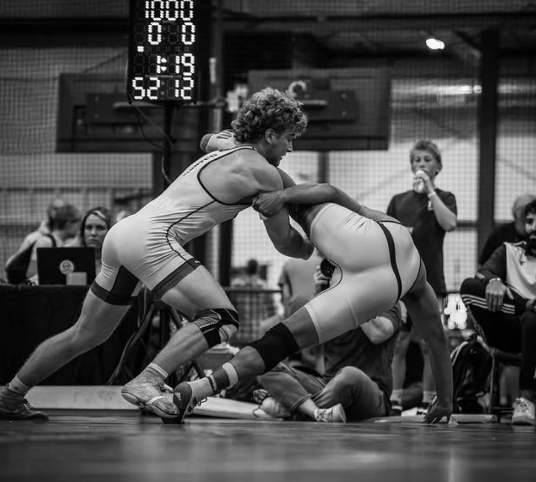 Wrestling action with scoreboard - black and white